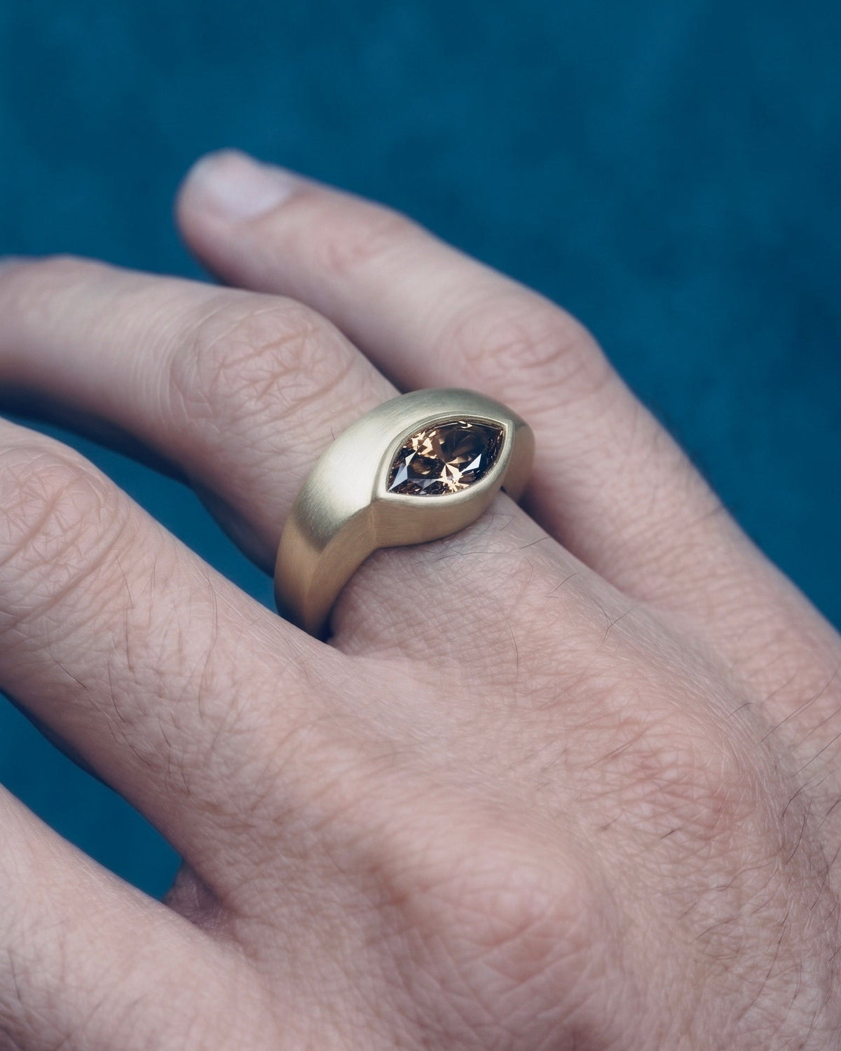 envelope ring worn on the index finger