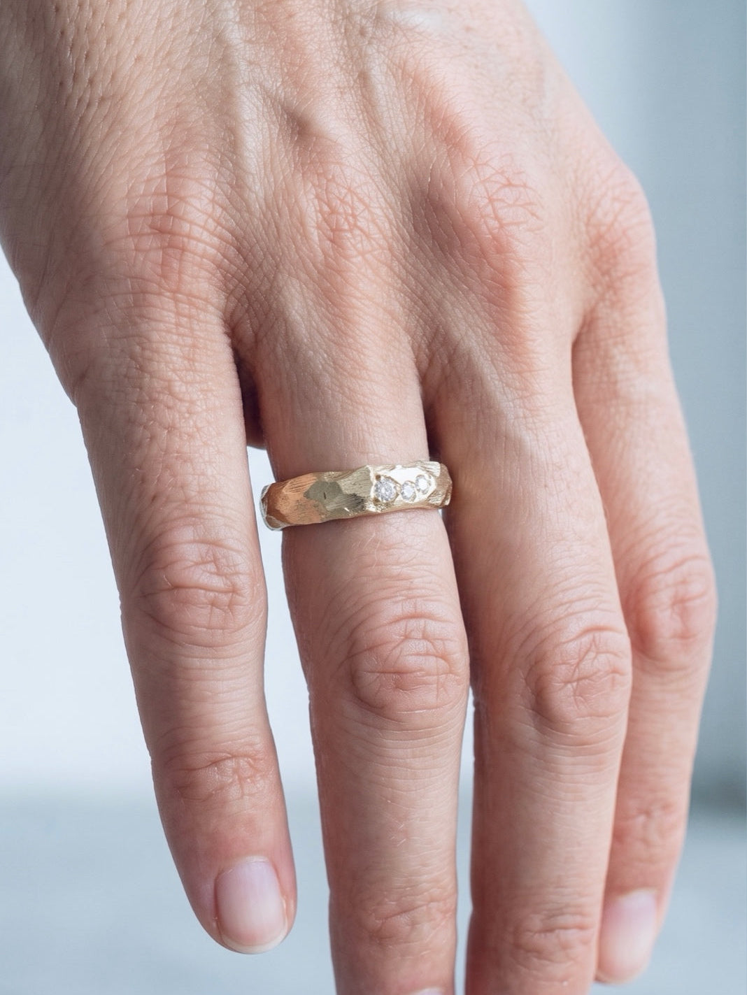 material ring III, hand-carved gold ring with diamonds, worn