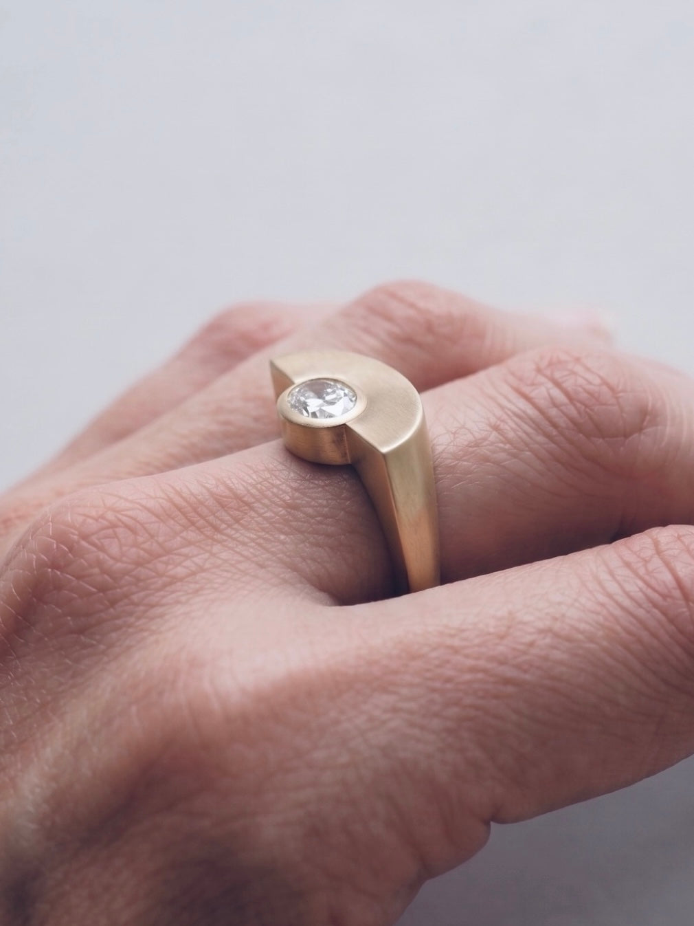 corner ring bezel — brushed gold finish detail
