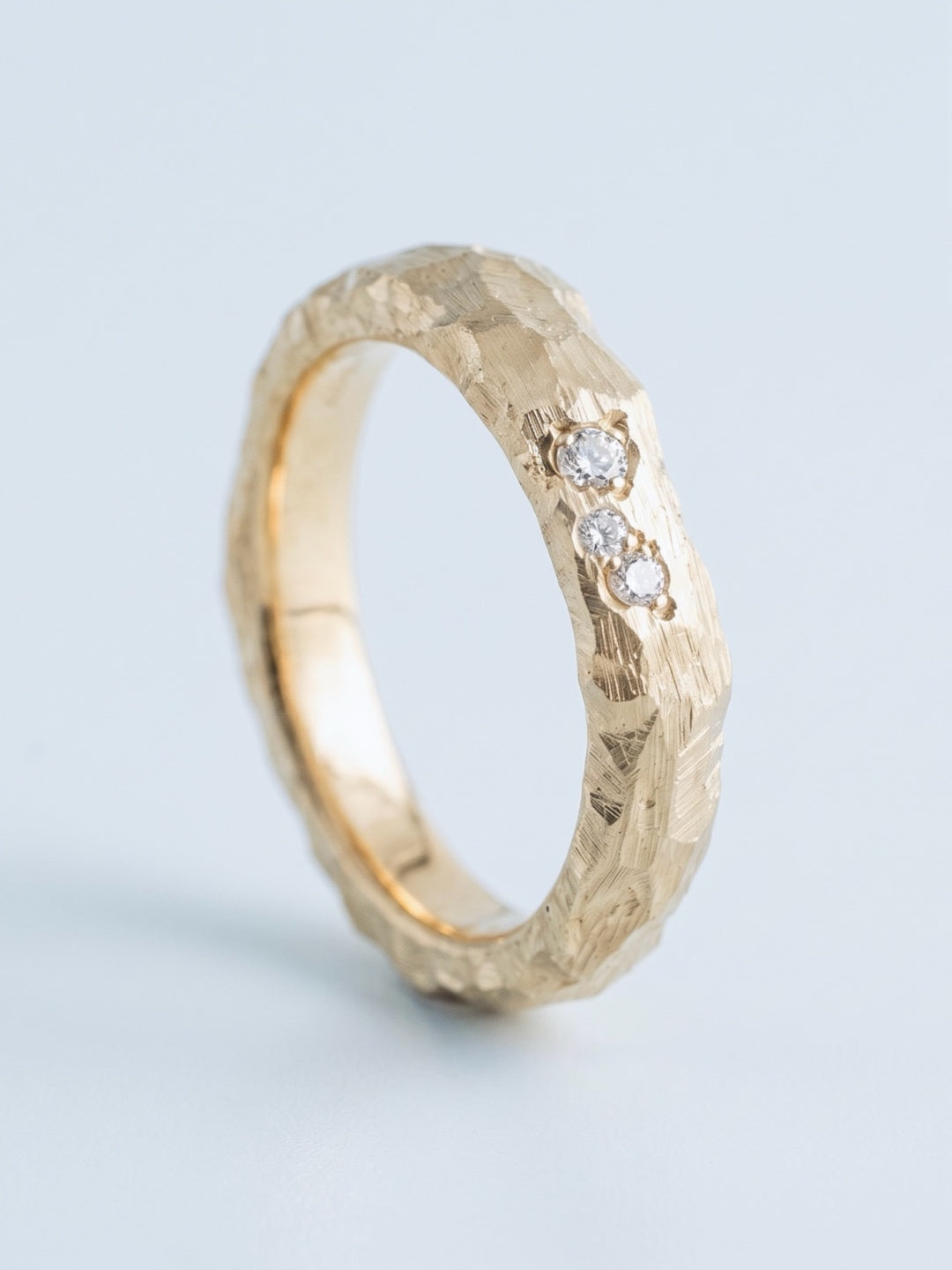 material ring III, irregular hand-carved planes in 18ct gold